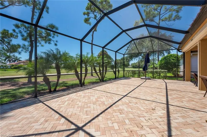 Unfurnished sunroom with vaulted ceiling
