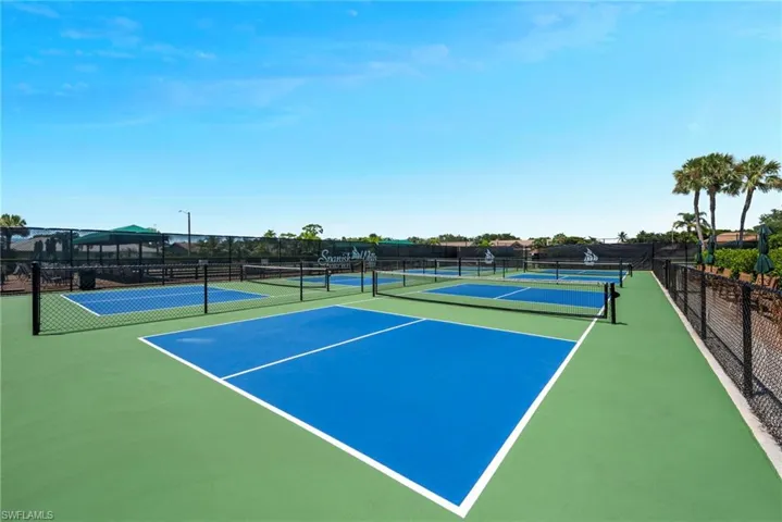 View of tennis court featuring community basketball court