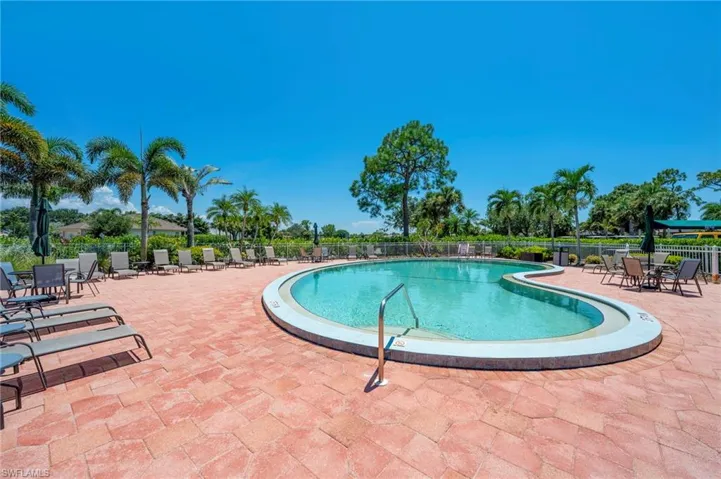 Community pool featuring a patio