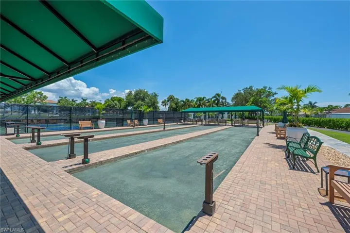View of property's community with a game area and a patio area