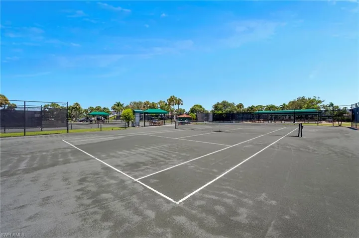 View of tennis court with community basketball court