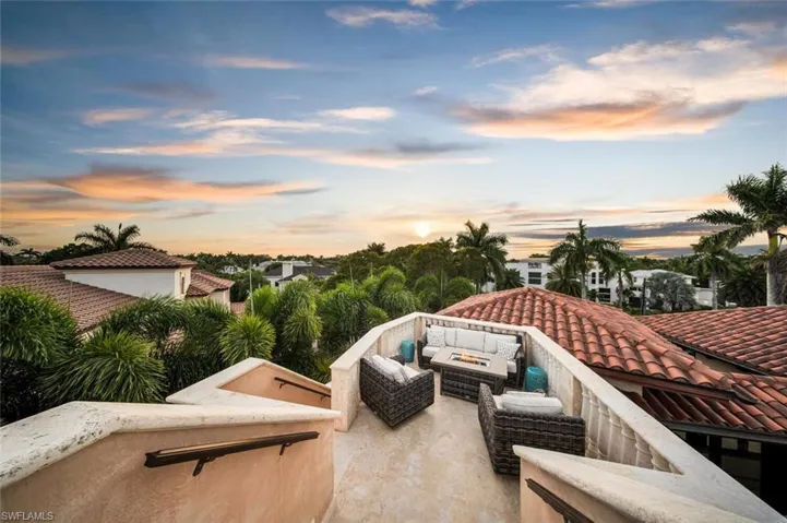 Patio terrace at dusk with an outdoor living space and a patio area