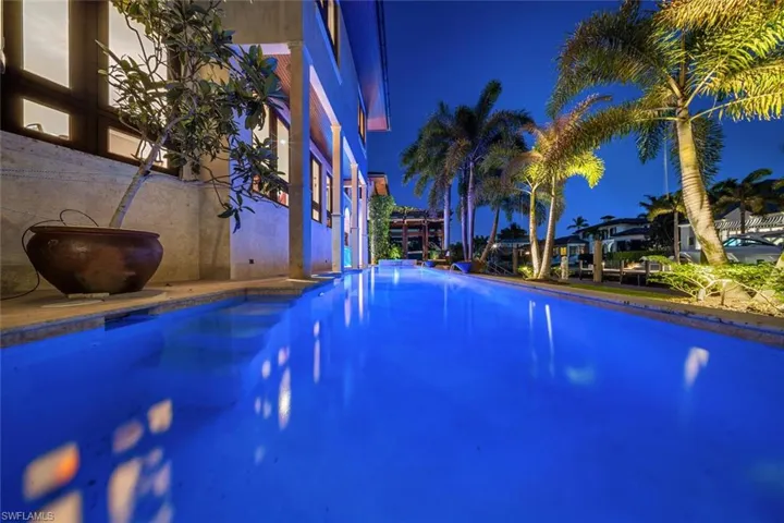 Pool at twilight featuring an outdoor pool