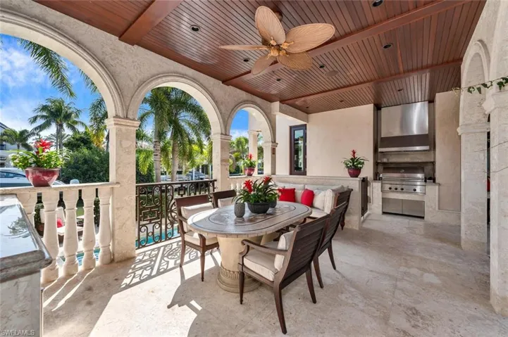 View of patio / terrace featuring area for grilling and a ceiling fan