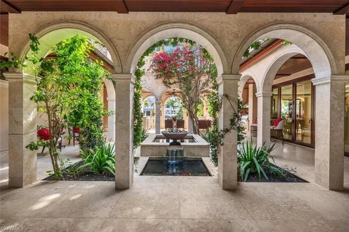 View of patio / terrace with a small pond