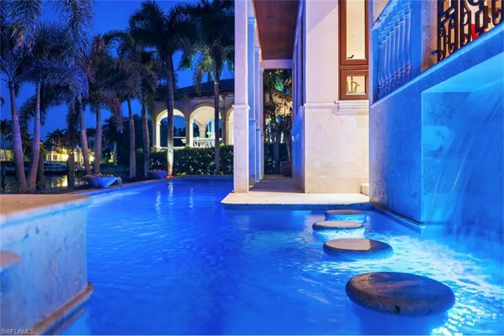 Pool at twilight featuring an outdoor pool and a patio
