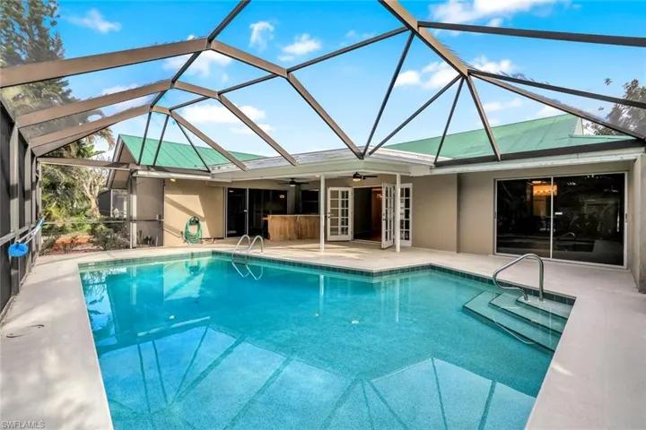 Outdoor pool with outdoor sitting area and outdoor kitchen