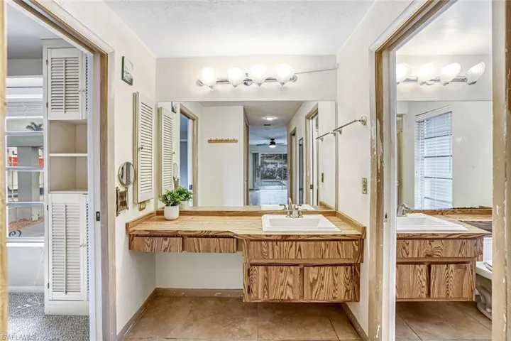 Full bath featuring vanity