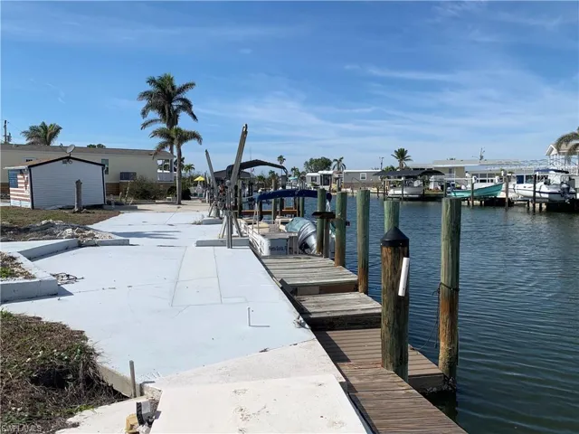 View of concrete dock and water view.