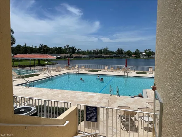 View of pool featuring a patio and central AC unit