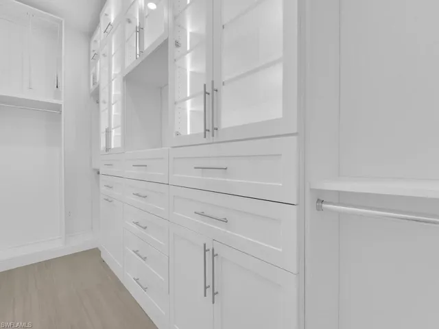 Master Bedroom - His/Her Custom Closets w/ Lighted & Glass Cabinets, Built-in Jewelry Drawer & Hamper, Pull-Down Shelving and More!