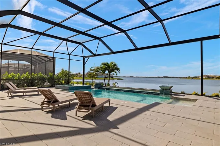 Gas Heated Pool & Spa, Sun Shelf, Picture Screening Lanai, Privacy Calusa Hedges & Beautiful View of the 580-Acre Boatable Lake