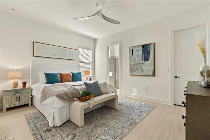 Guest Bedroom 3 - Suite with walk-in closet, private bathroom with pool access & ceiling fan