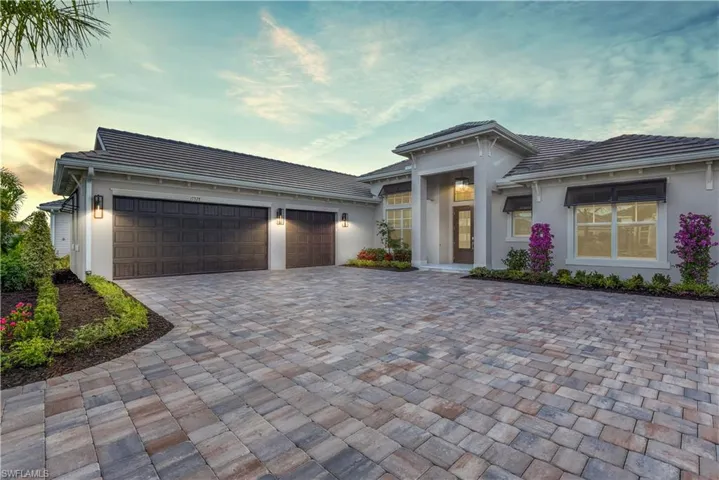 Exterior Lights, Chandelier, Awnings over Windows, Pristine Landscaping, Step-Up Tile Front Entry Installed