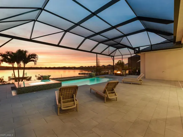 Infinity Pool & Spa at dusk with Beautiful Southwestern Sunset View of 580-Acre Boatable Lake