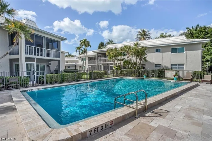 Paved and fenced pool