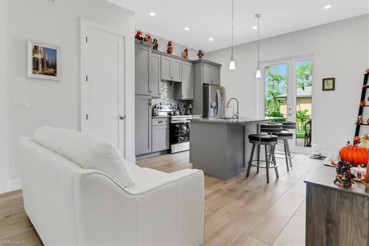 Guest Suite 1 - Kitchen & Living Area. The Sliders Lead to a Private Fenced-In Running Area