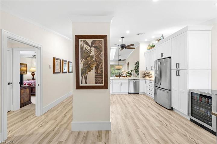 View facing spacious hallway to guest quarters/living area and kitchen