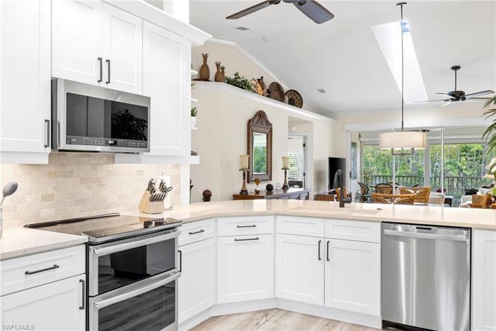 View standing in kitchen in front refrigerator