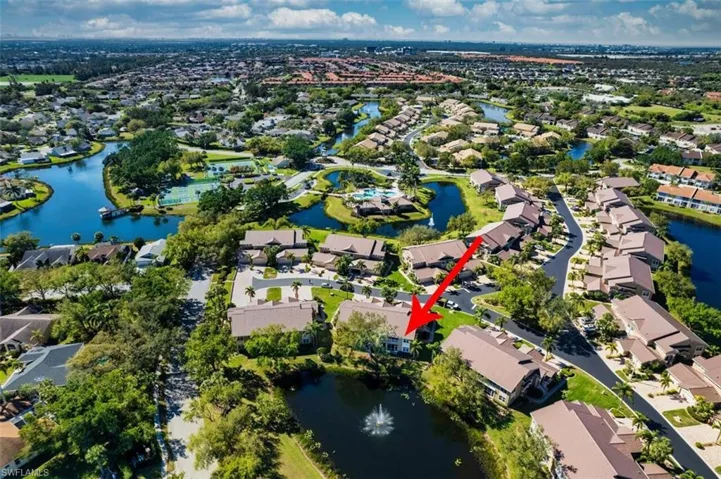 Birds eye view of property featuring a residential view and a water view
