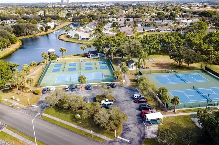 Birds eye view of property with a water view