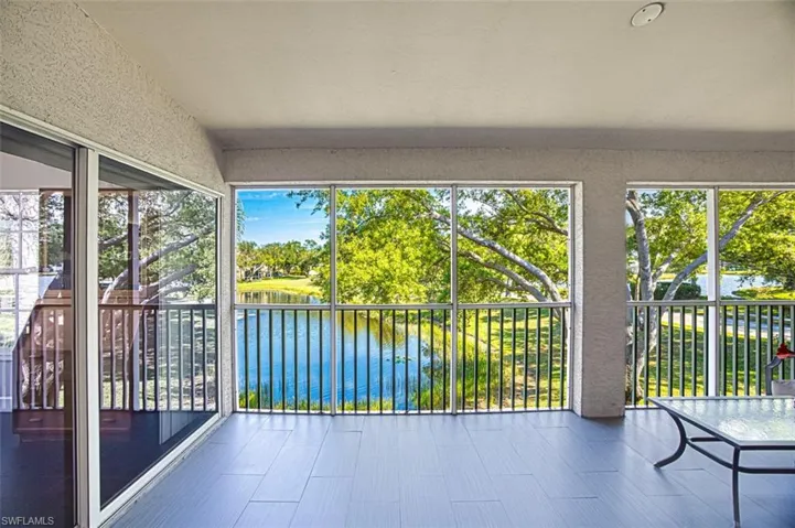 Unfurnished sunroom with a water view and a wealth of natural light