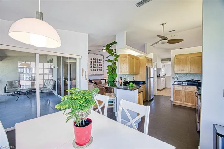 Dining room featuring a ceiling fan and visible vents