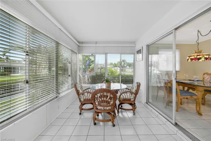 View of sunroom with water views
