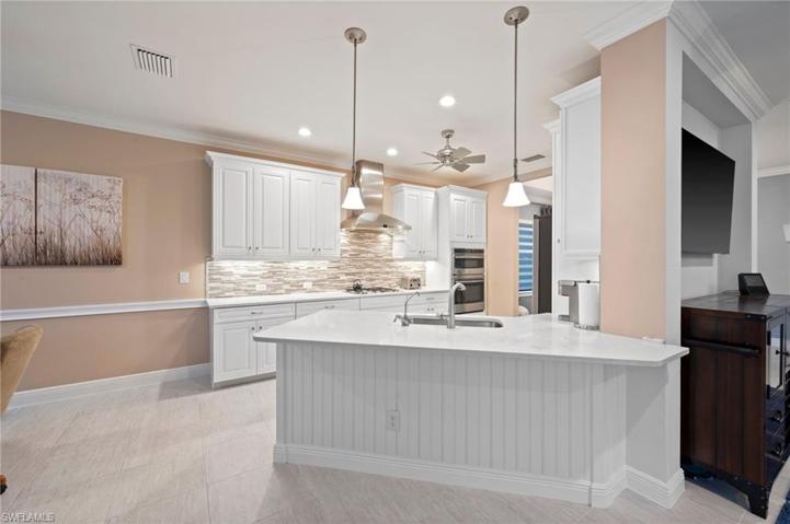 Breakfast bar with beautiful Quartz counter tops in all of the kitchen