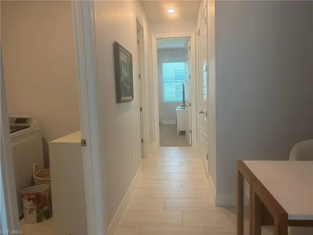 Hallway to 2 bedrooms, full bath and large hall closet