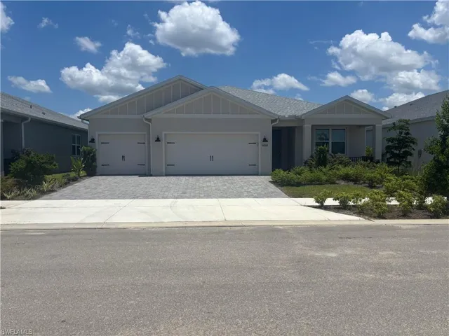 Front view of home with 3 car garage