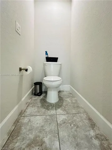 Bathroom featuring a textured wall