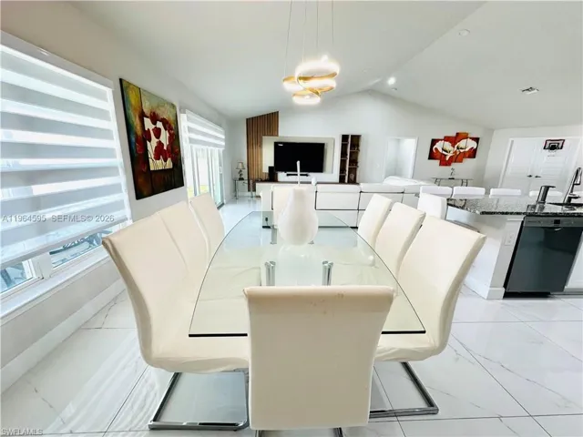 Dining area with light marble finish flooring