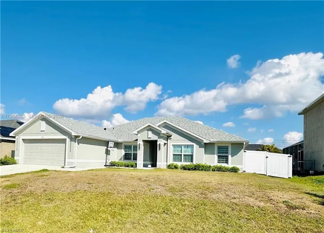 Ranch-style house with a gate, stucco siding, concrete driveway, and an attached garage