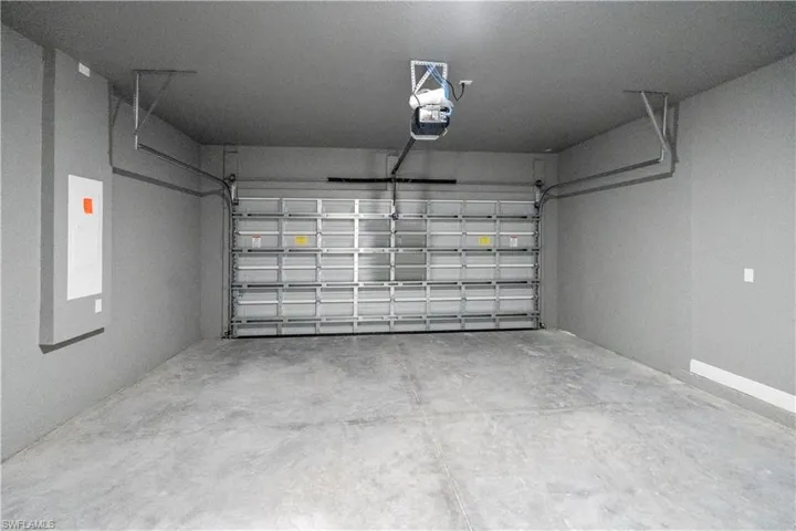 Garage featuring a garage door opener