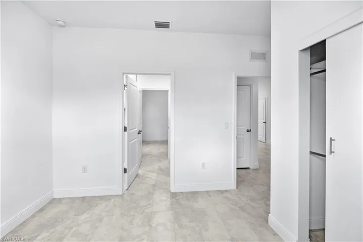 Unfurnished bedroom featuring baseboards