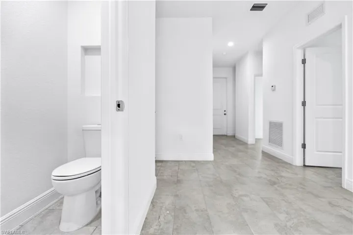 Bathroom with baseboards and recessed lighting