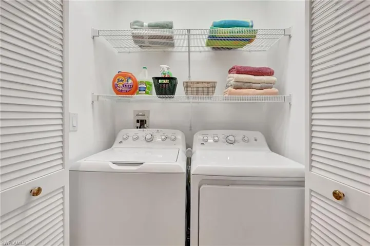 Laundry area with washing machine and clothes dryer