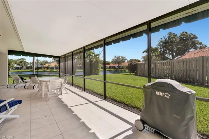 Unfurnished sunroom with outdoor dining space, a water view, and plenty of natural light