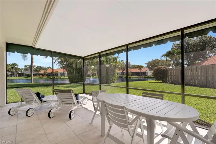 Sunroom / solarium featuring outdoor dining area, a water view, and plenty of natural light