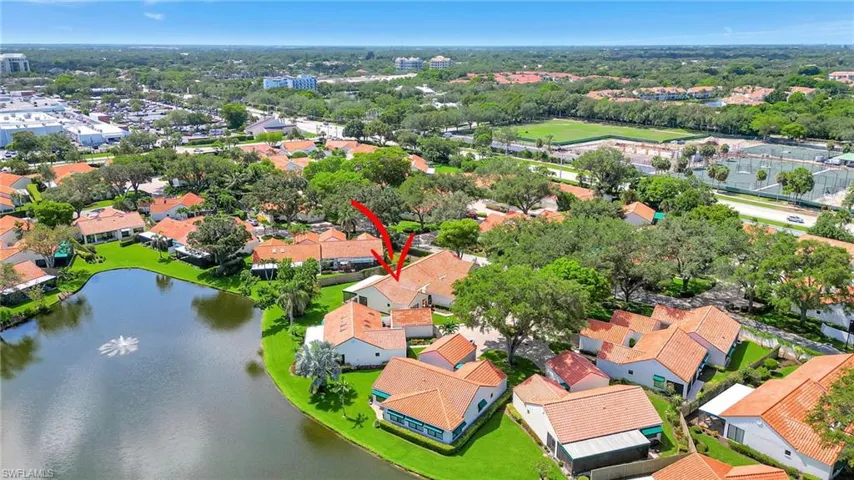 Aerial view of residential area with a large body of water