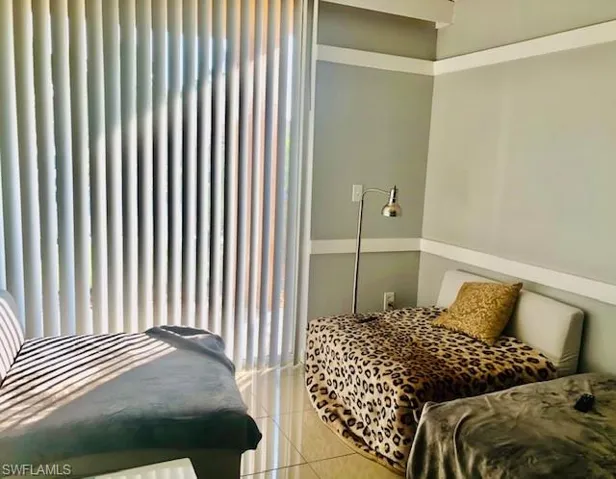 Bedroom featuring tile patterned floors