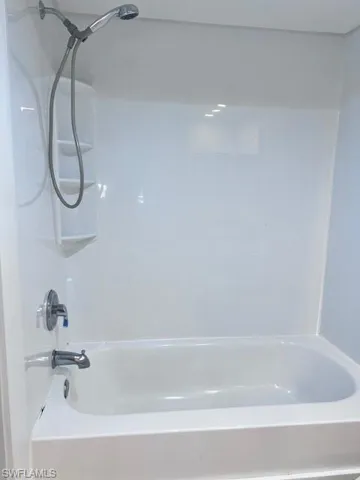 Bathroom featuring shower / washtub combination