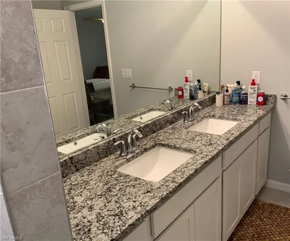Primary Bathroom  dual Sink with Granite Countertop