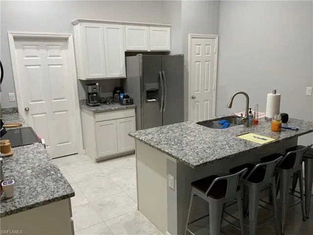 Kitchen with Stainless Steel Fridge