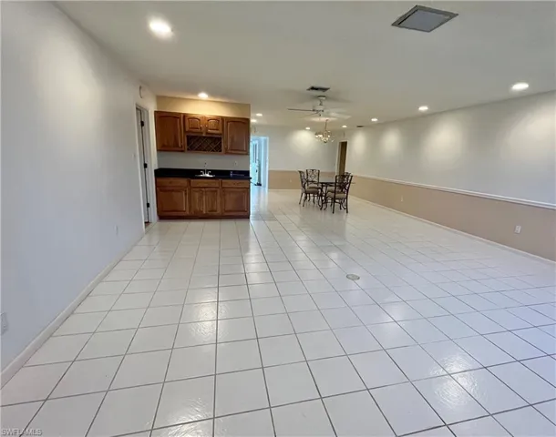 Kitchen featuring ceiling fan and light tile patterned flooring