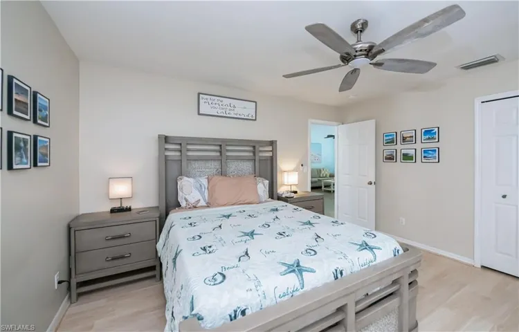 Neutral furnishings and ceiling fan for sleeping comfort