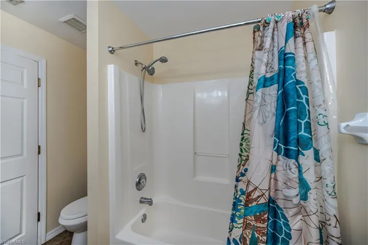 Guest bathroom featuring shower / bath combination