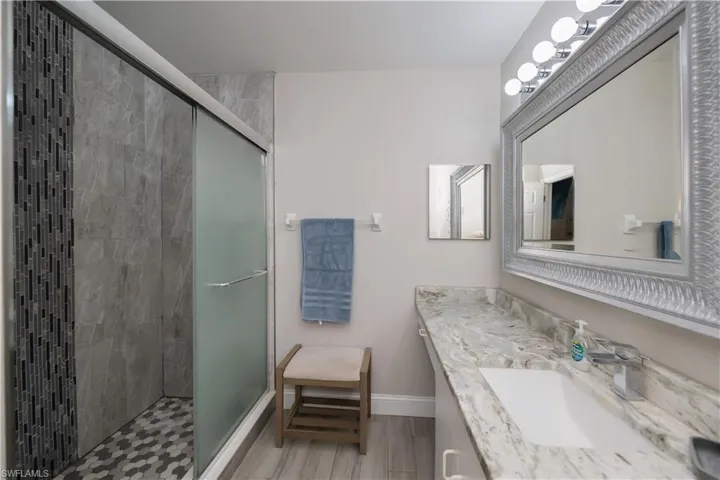 Tranquil en suite with custom tile in your walk in shower
