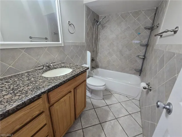 2nd floor main bathroom with single vanity with granite.